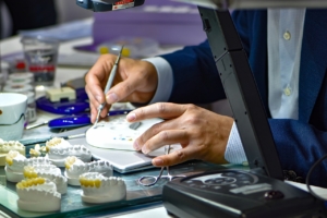 a dental tech working on crowns